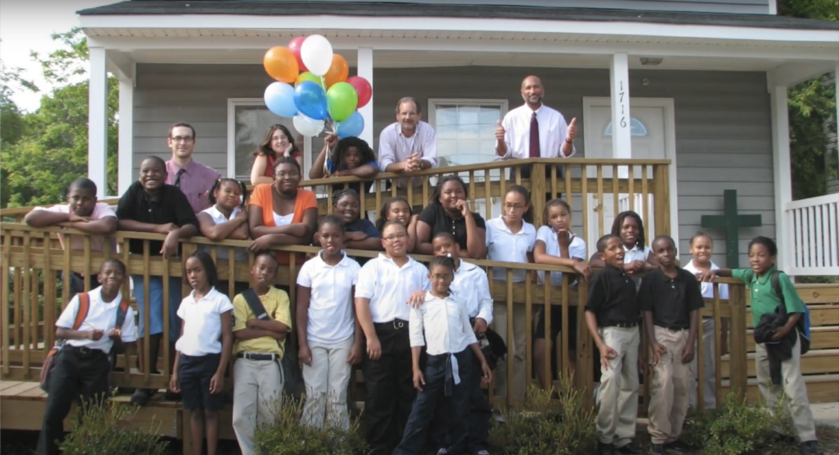 Students and staff outside the first Anna Julia Cooper School building, 2009