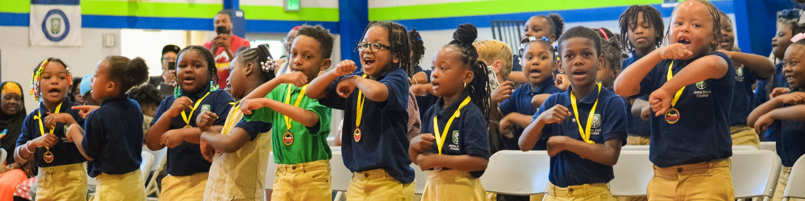 Lower school students dancing at the end of year awards assembly.